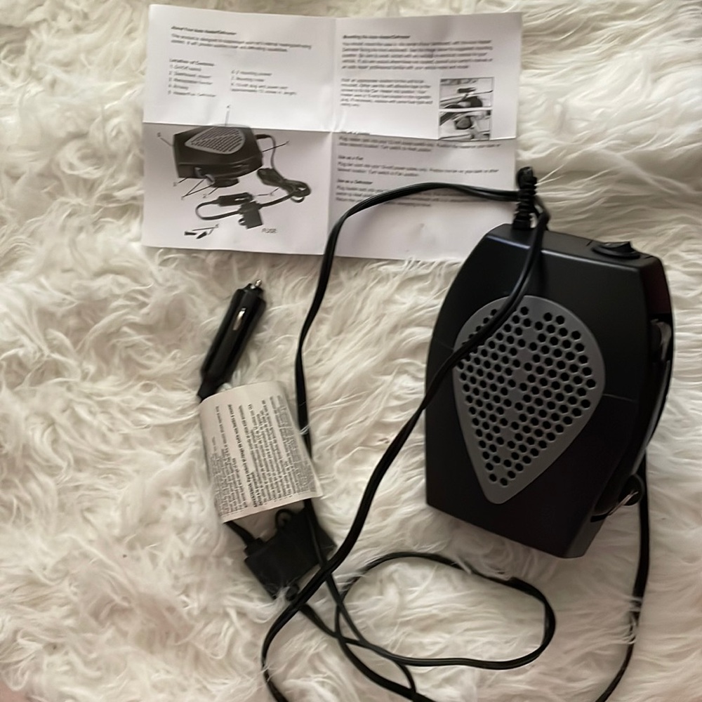 Portable auto heater. Mount w/3M tape or screws. Rotating base and has handles.